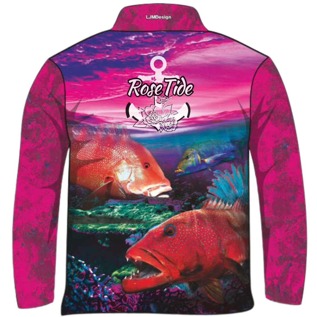 Long-sleeve fishing shirt with a with a gradient pink and purple sky background above a coral reef scene print, featuring prominent snapper fish among coral. Includes the 'Rose Tide' brand logo on the chest.